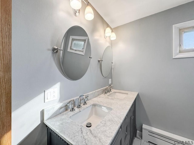 bathroom with vanity and a baseboard radiator