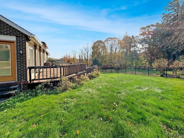 view of yard with a deck