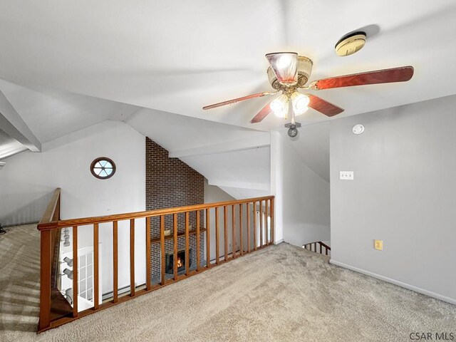 bonus room with lofted ceiling, carpet floors, and ceiling fan