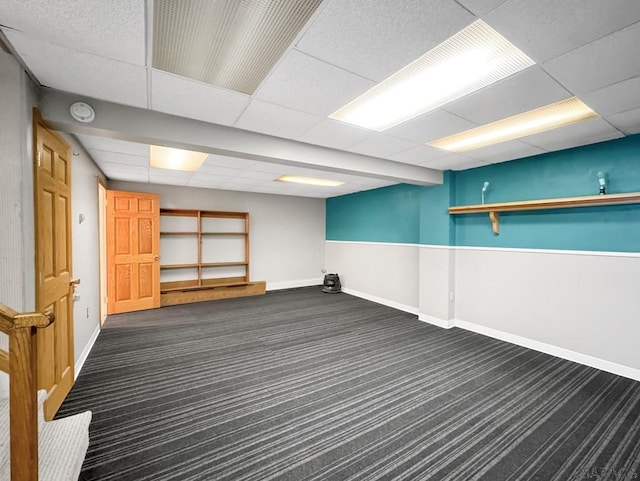 basement featuring dark colored carpet