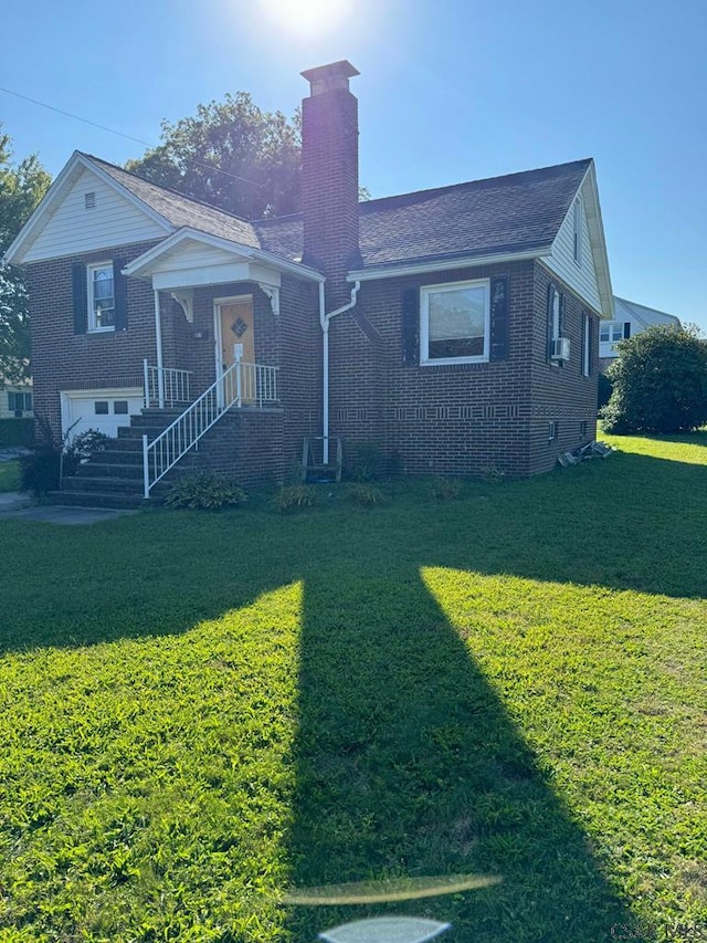 view of front of house featuring a garage and a front yard