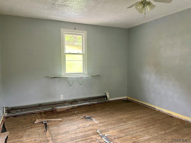 unfurnished room with ceiling fan, hardwood / wood-style flooring, a textured ceiling, and baseboard heating