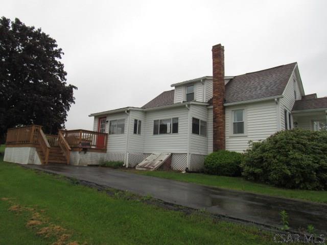 619 W Race St, Somerset, PA 15501 - back of house with a wooden deck, a chimney, and a shingled roof
