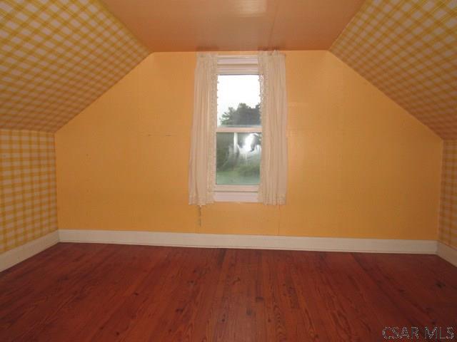 619 W Race St, Somerset, PA 15501 - bonus room with lofted ceiling, wood finished floors, and baseboards