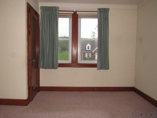619 W Race St, Somerset, PA 15501 - carpeted spare room featuring baseboards