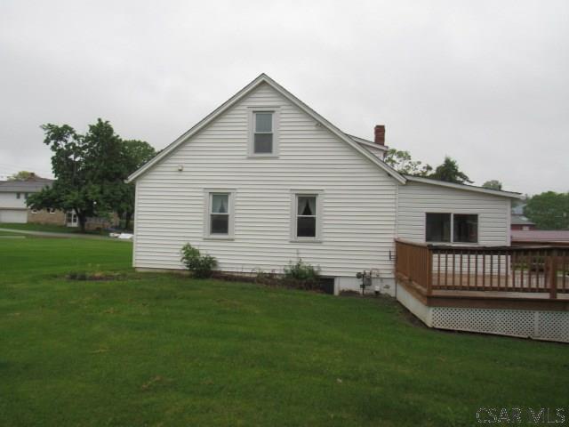 619 W Race St, Somerset, PA 15501 - back of property with a wooden deck, a yard, and a chimney