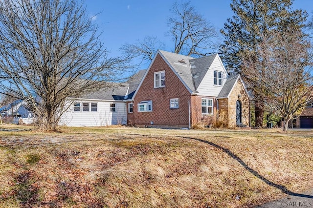 view of home's exterior with brick siding