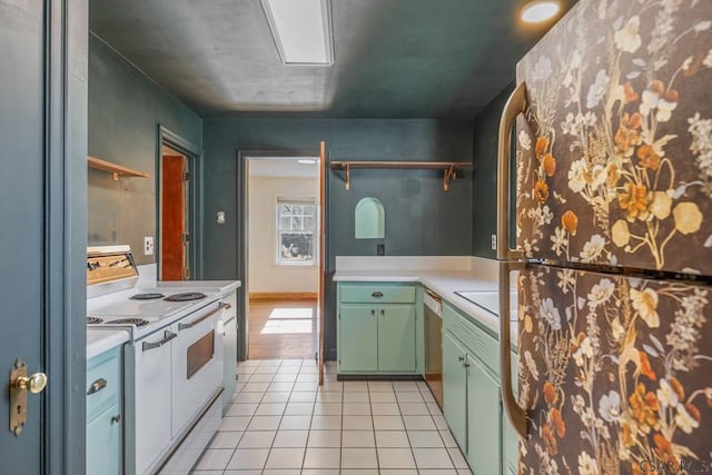 kitchen featuring light tile patterned floors, light countertops, white electric range, open shelves, and green cabinetry