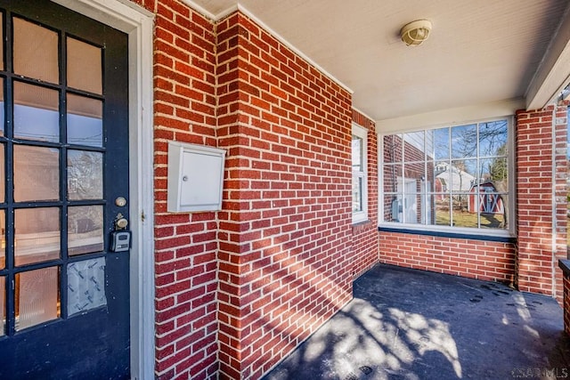 entrance to property with brick siding