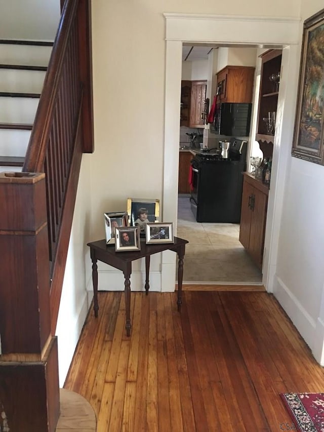 hallway with light hardwood / wood-style flooring