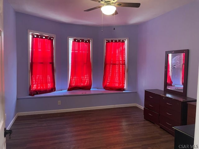 unfurnished bedroom featuring dark wood-style floors and baseboards