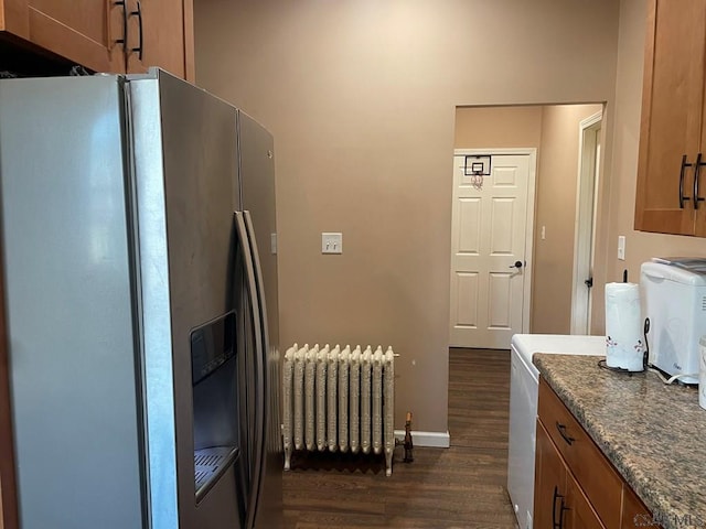 kitchen with brown cabinets, radiator heating unit, stainless steel refrigerator with ice dispenser, and dark wood-style flooring