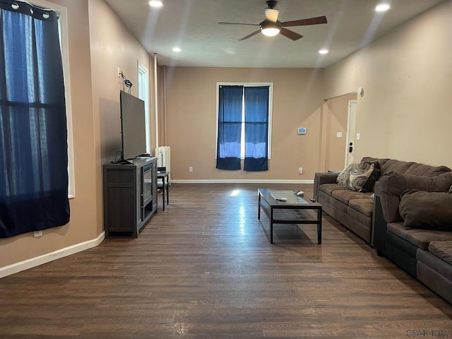 living area with dark wood finished floors, recessed lighting, baseboards, and a ceiling fan