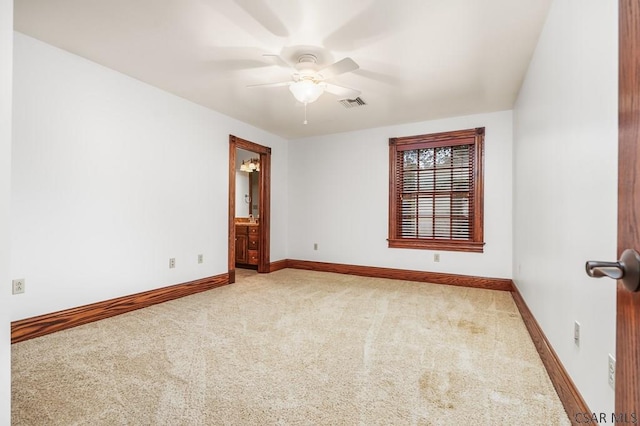 carpeted empty room with ceiling fan