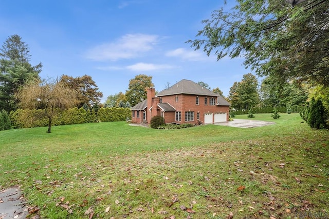 view of yard featuring a garage