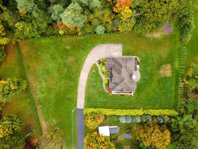 birds eye view of property with a rural view