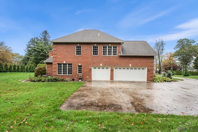 exterior space with a yard and a garage