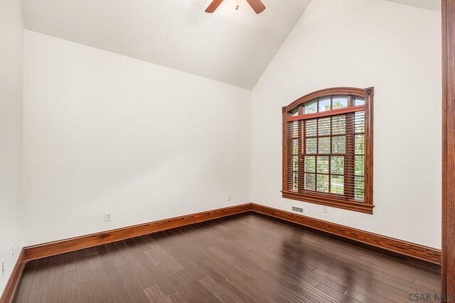 empty room featuring wood-type flooring, high vaulted ceiling, and ceiling fan