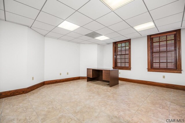 empty room with a drop ceiling