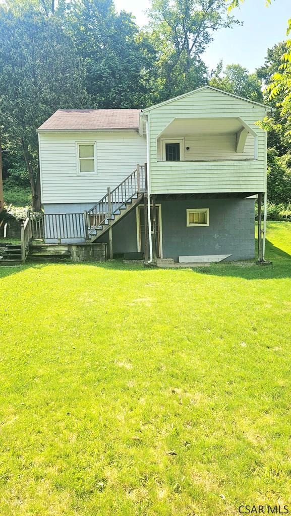 241 Grazier St, Johnstown, PA 15906 - rear view of property featuring stairs and a lawn