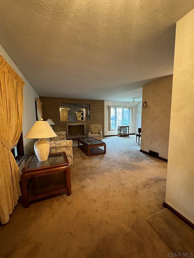 carpeted living room with a textured ceiling