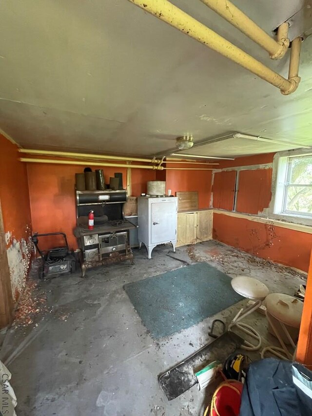 424 W Main St, Stoystown, PA 15563 - misc room with unfinished concrete floors and a garage