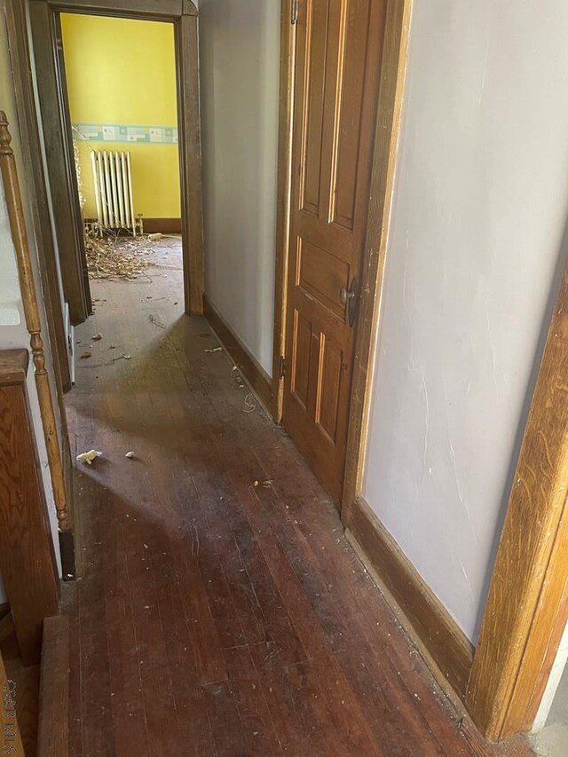 424 W Main St, Stoystown, PA 15563 - corridor with wood-type flooring, baseboards, and radiator
