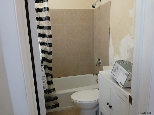 bathroom featuring shower / bath combination with curtain and toilet