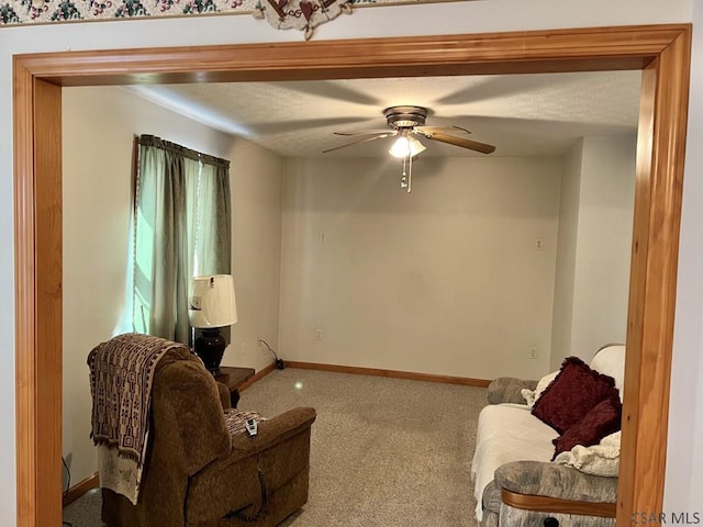 living room featuring ceiling fan and carpet