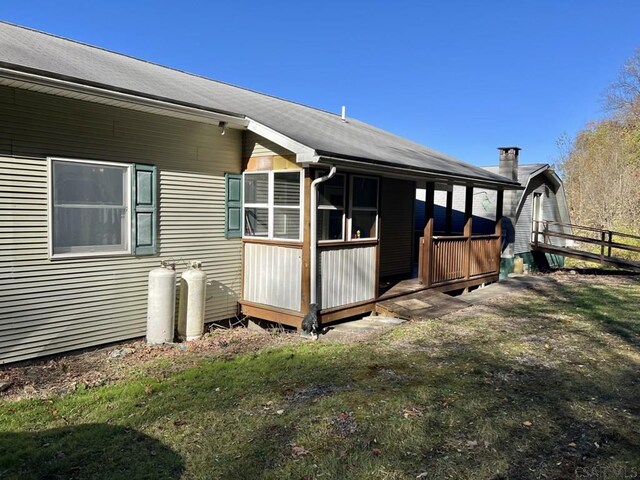 view of property exterior with a yard