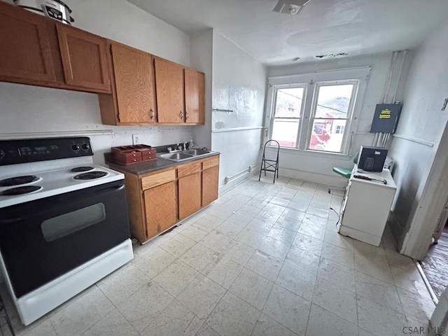 kitchen with electric stove and sink