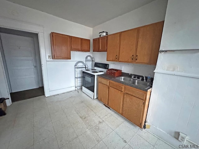 kitchen featuring sink and electric range