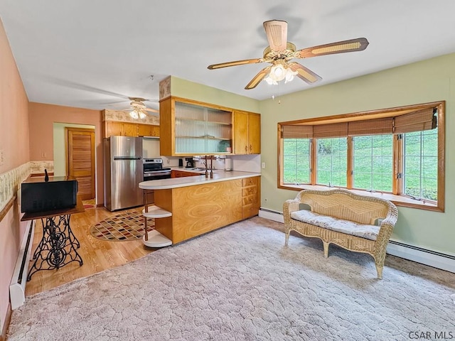 500 Randolph St, Ebensburg, PA 15931 - kitchen with appliances with stainless steel finishes, open shelves, a ceiling fan, a sink, and a peninsula