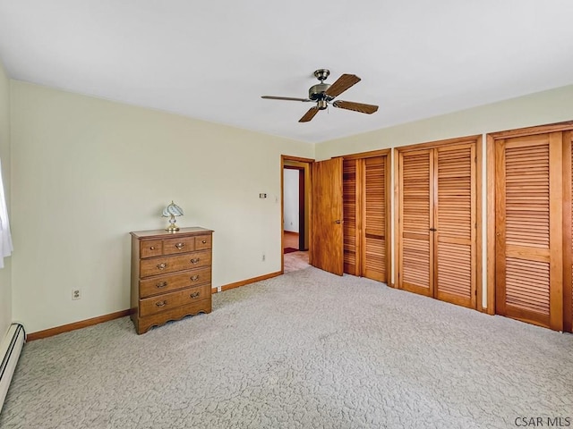 500 Randolph St, Ebensburg, PA 15931 - bedroom featuring two closets, carpet, baseboards, baseboard heating, and a ceiling fan