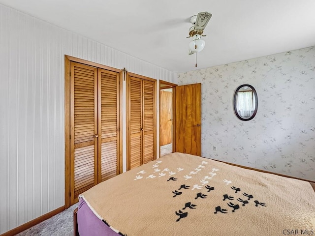 500 Randolph St, Ebensburg, PA 15931 - bedroom with carpet floors, wallpapered walls, multiple closets, ceiling fan, and baseboards