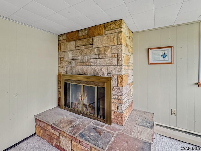 500 Randolph St, Ebensburg, PA 15931 - detailed view of a baseboard heating unit, a stone fireplace, and carpet flooring