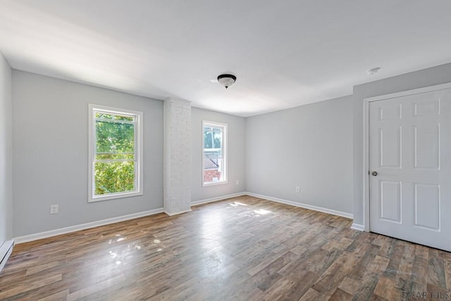 empty room featuring hardwood / wood-style flooring