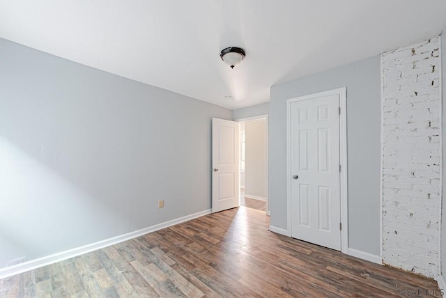 unfurnished bedroom featuring wood-type flooring