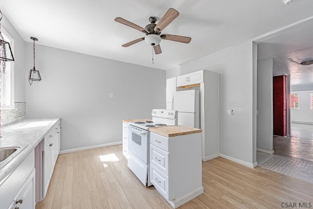 kitchen featuring pendant lighting, white appliances, light hardwood / wood-style flooring, white cabinetry, and wood counters