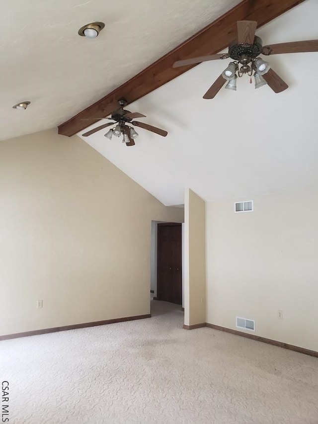 unfurnished room with vaulted ceiling with beams, light carpet, visible vents, and baseboards