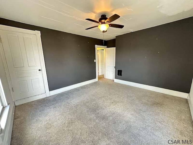 unfurnished bedroom with carpet flooring and ceiling fan