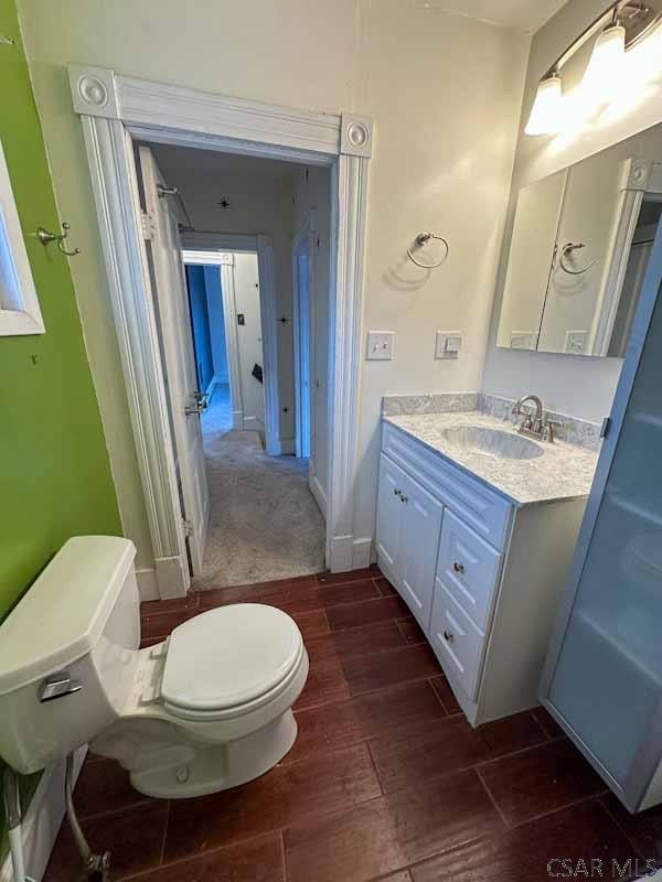 bathroom with vanity and toilet