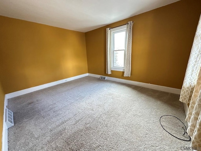 view of carpeted spare room