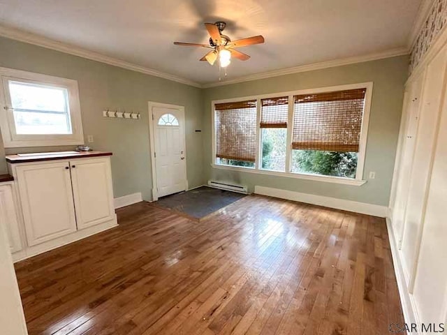 entryway featuring hardwood / wood-style flooring, plenty of natural light, and baseboard heating