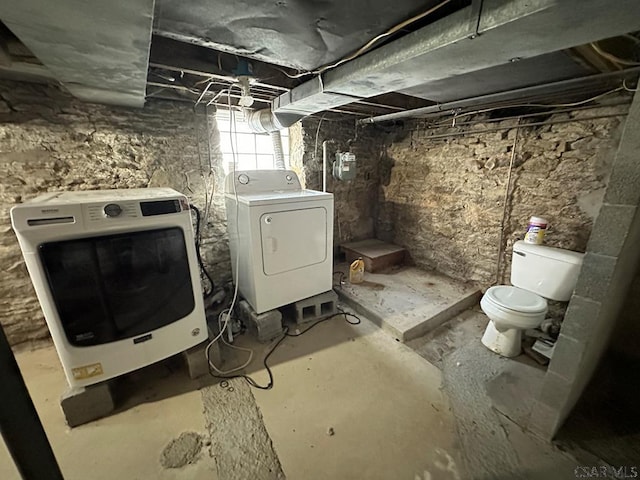 basement with washer and clothes dryer and heating unit