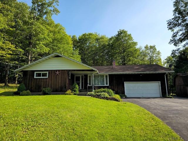 1827 Saylor School Rd, Boswell, PA 15531 - view of front of property featuring board and batten siding, driveway, a front lawn, and a garage