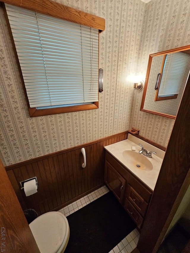 1827 Saylor School Rd, Boswell, PA 15531 - half bathroom with tile patterned flooring, a wainscoted wall, wallpapered walls, vanity, and toilet