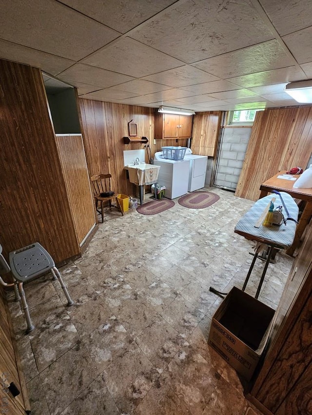 1827 Saylor School Rd, Boswell, PA 15531 - below grade area with wood walls, washer and clothes dryer, a drop ceiling, and a sink