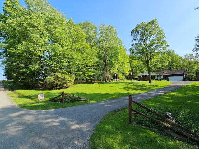 1827 Saylor School Rd, Boswell, PA 15531 - view of property's community featuring a yard, asphalt driveway, and an attached garage