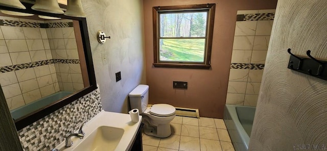 full bath featuring vanity, a baseboard radiator, bathing tub / shower combination, and toilet
